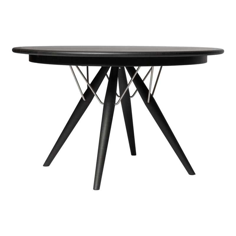 Black round dining table with a geometric wire design and tapered wooden legs. Sleek modern aesthetic perfect for any decor.