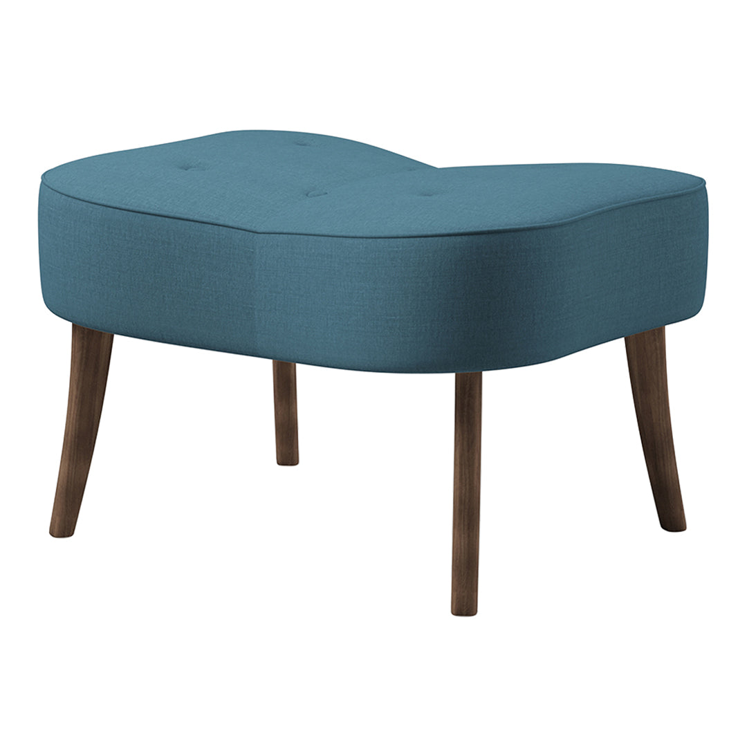 Turquoise upholstered ottoman with a sleek, curved design and walnut legs, featuring subtle tufted detailing.