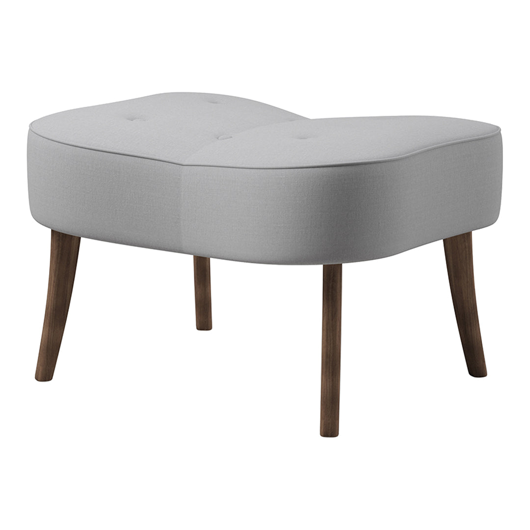 Light gray upholstered ottoman with a soft curved design and wooden legs. Elegant and modern for any living space.