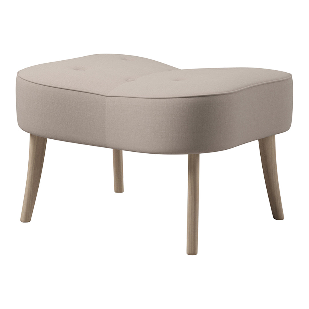 Light beige upholstered ottoman with button-tufted design and natural wood legs, featuring a soft, curved silhouette.