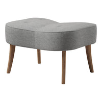 Stylish gray ottoman with a unique curved shape and textured fabric, complemented by wooden legs. Perfect for modern decor.