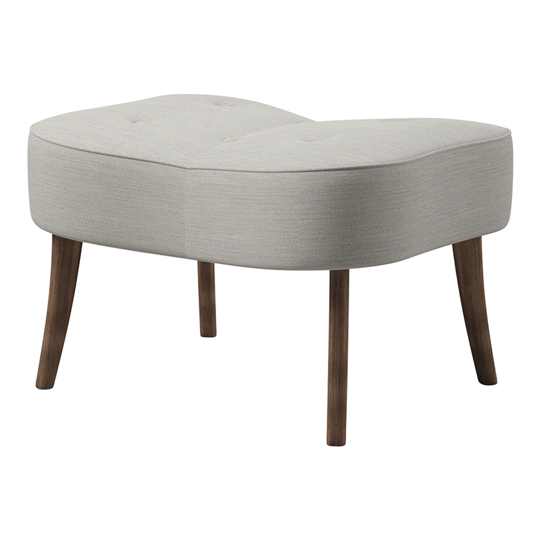 Light gray upholstered ottoman with a curved design and subtle textured pattern, supported by wooden legs.