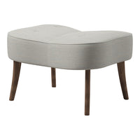 Light gray upholstered ottoman with a curved design and subtle textured pattern, supported by wooden legs.