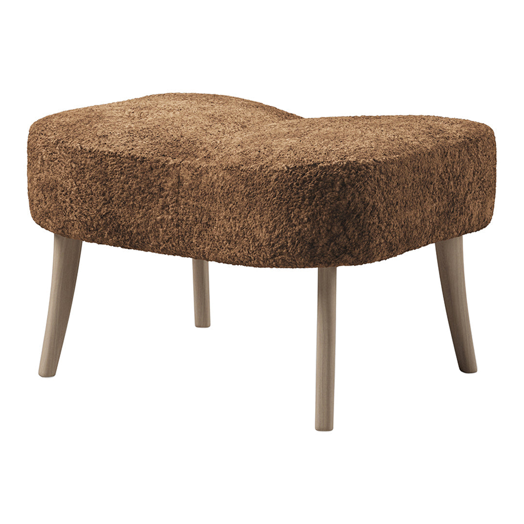 Brown, textured stool with a soft, fuzzy surface and light gray legs, perfect for a cozy, modern decor.