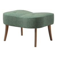 Green patterned ottoman with a unique shape and wooden legs, featuring a textured, tufted design.