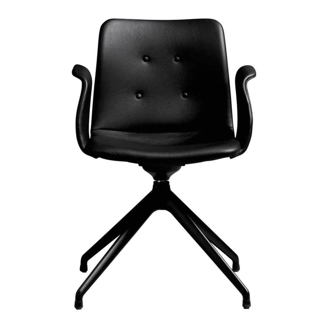 Black upholstered chair with a button-tufted design and sleek, modern armrests on a minimalist base.