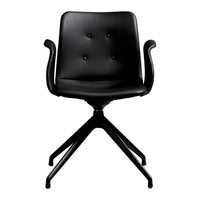 Black upholstered chair with a button-tufted design and sleek, modern armrests on a minimalist base.
