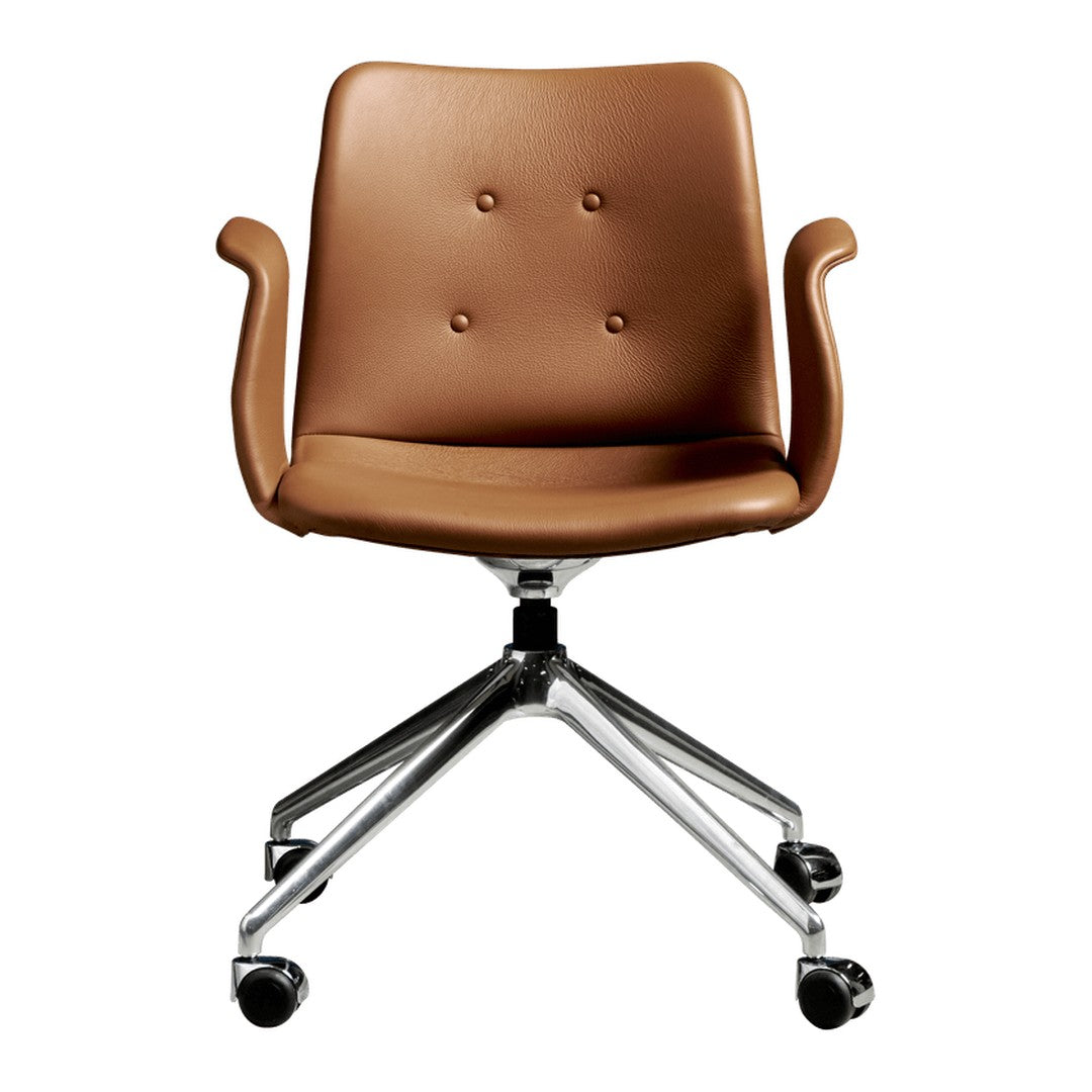 Brown upholstered chair with a smooth finish and button-tufted detailing, set on a chrome rolling base.