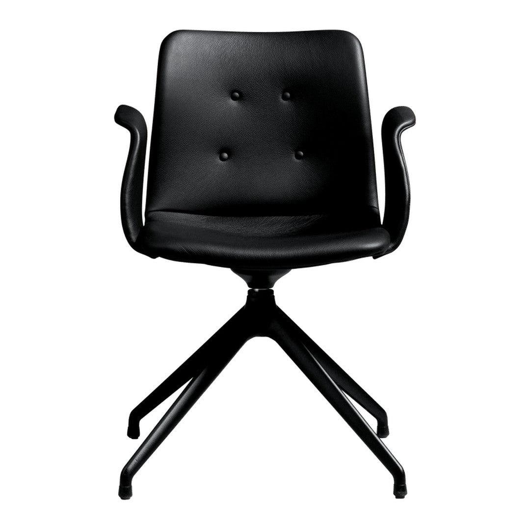 Black leather swivel chair with button-tufted back and sleek black base; modern design for any workspace.