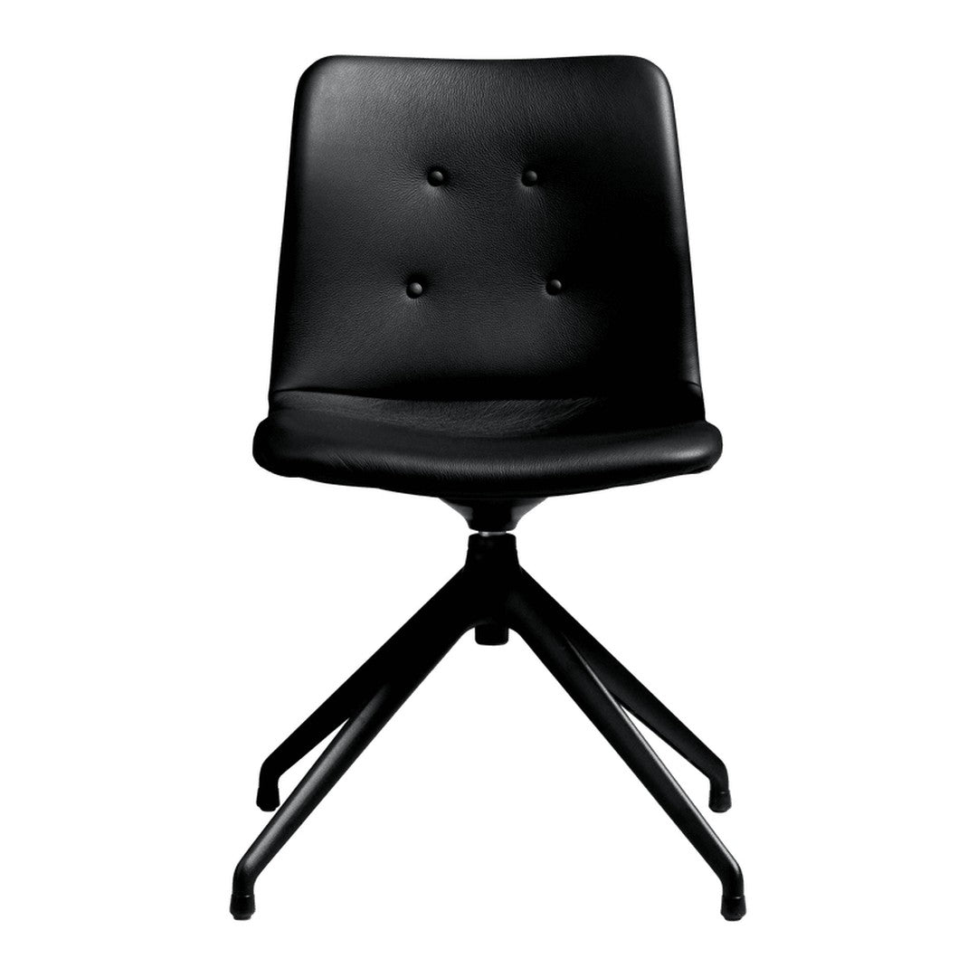 Modern black swivel chair with button tufting and sleek minimalist design, perfect for contemporary spaces.