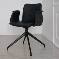 Stylish black chair featuring a smooth finish and subtle button detailing. Ideal for modern interiors.