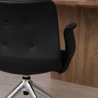 Black ergonomic chair with a sleek design and chrome base, featuring a subtle button-tufted pattern.