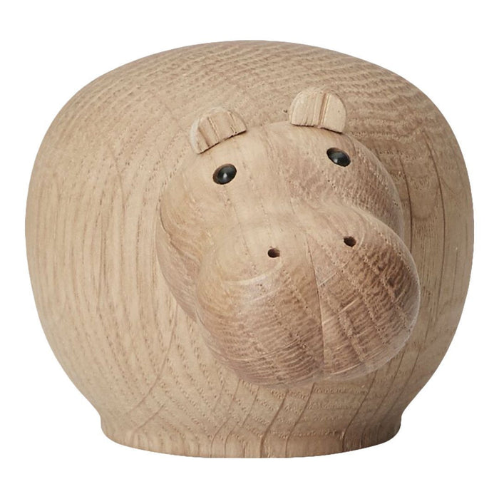 Natural wooden hippo figurine with a smooth, light wood grain and subtle round patterns. Perfect for home decor.
