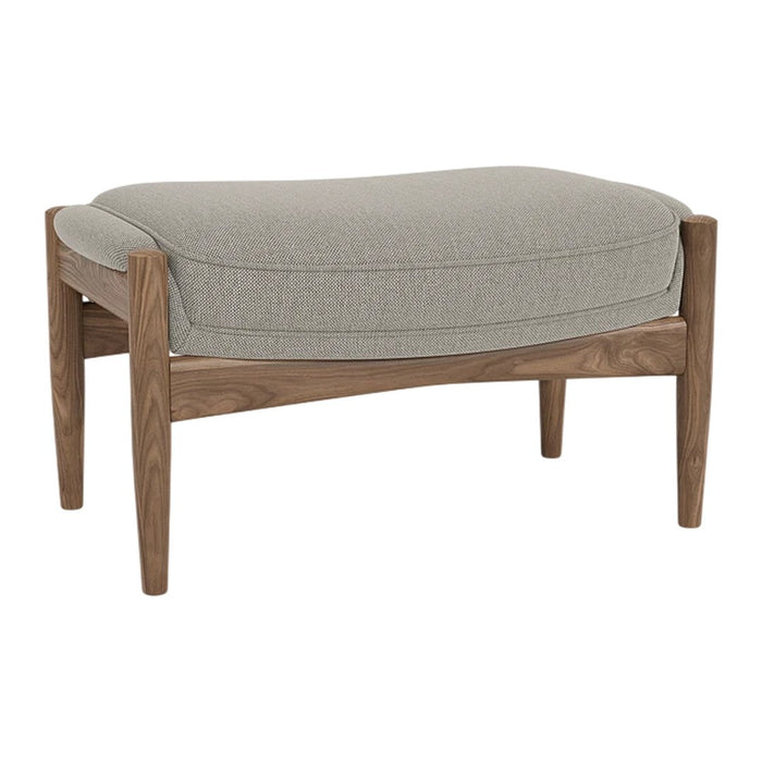 Light gray upholstered ottoman with a smooth, curved top and natural wood legs, showcasing a minimalist design.