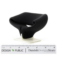 Sleek black chair with modern curves, featuring a minimalist white base and no visible patterns.