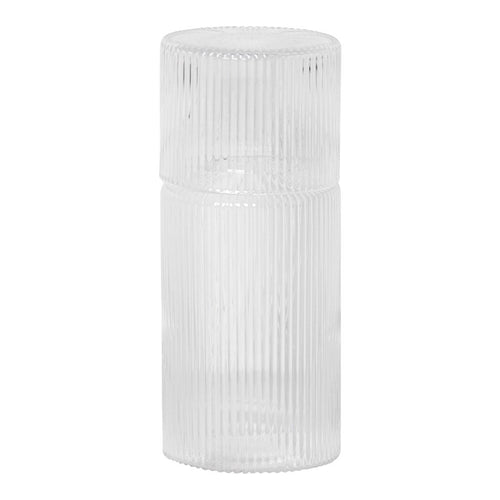 Clear glass container with vertical ribbed texture, ideal for stylish home decor or storage solutions.