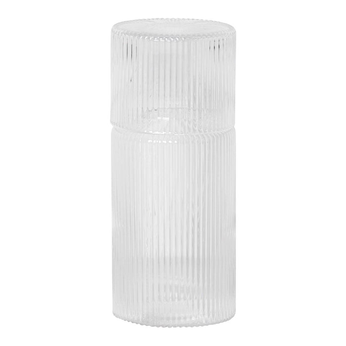 Clear glass container with vertical ribbed texture, ideal for stylish home decor or storage solutions.