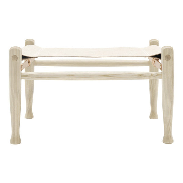 Light wooden bench with a smooth, cream-colored fabric seat, featuring a minimalist design and elegant finish.