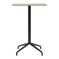 Black metal base with a light beige, textured top in a minimalist design. Perfect for modern spaces.
