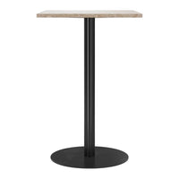 Black metal base with a round pedestal supporting a square, light beige textured tabletop.