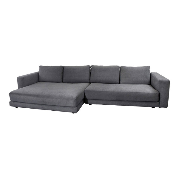 Gray sectional sofa with a smooth fabric finish and minimalist design, perfect for modern living spaces.