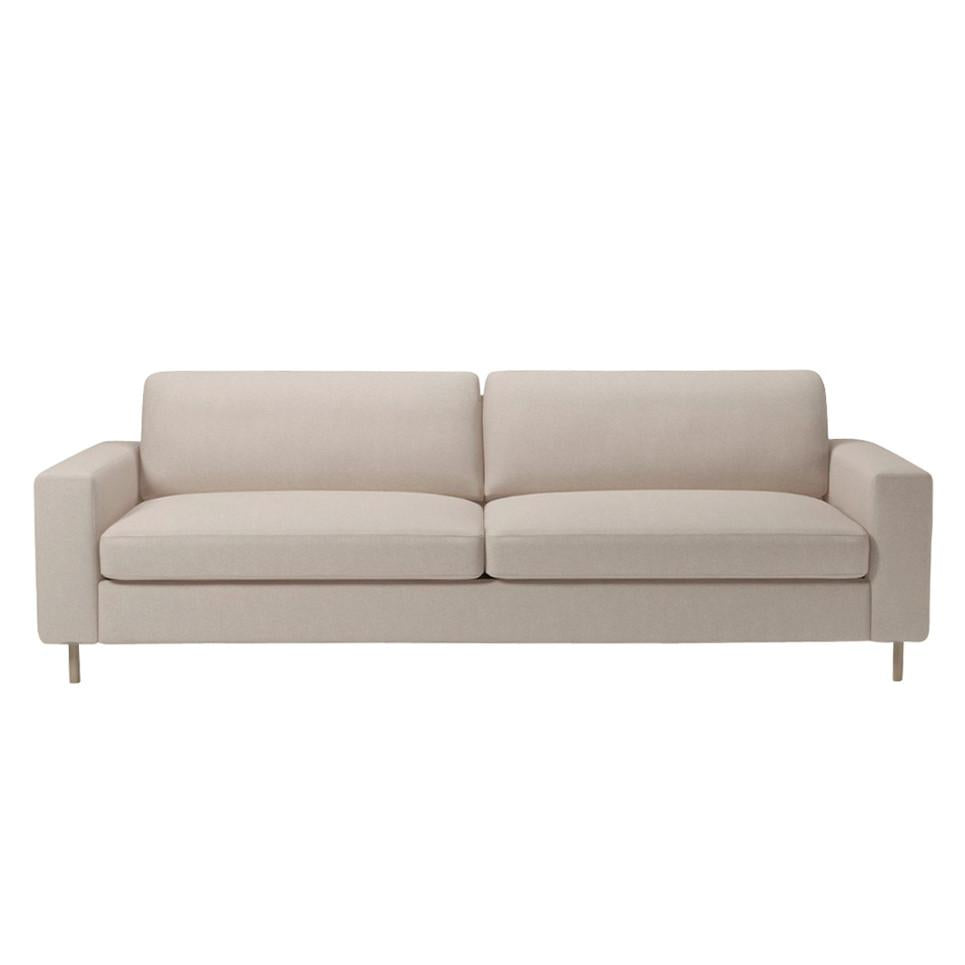 Soft beige upholstered sofa with sleek, modern lines and subtle texture, perfect for any contemporary living space.