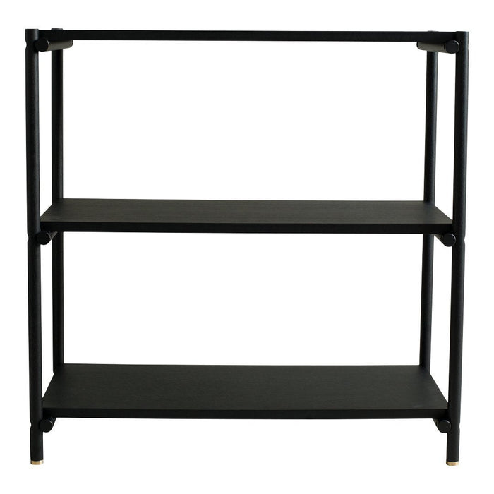 Black metal shelving unit with two shelves, featuring a sleek modern design and gold accents on the legs.