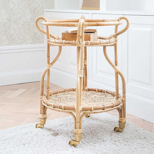 Natural rattan serving cart featuring a light beige color and woven pattern, perfect for stylish home decor.