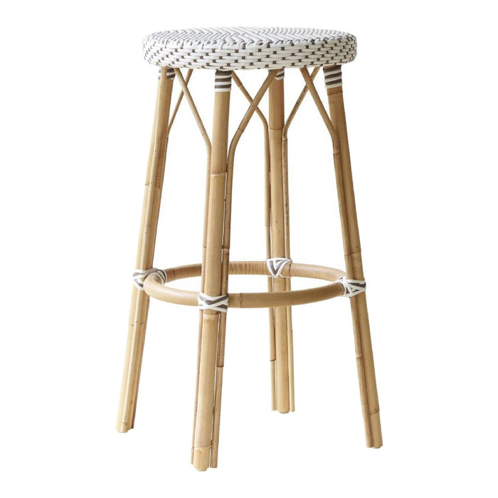 Woven white seat with black dotted pattern on a natural bamboo stool, showcasing minimalist, earthy tones.