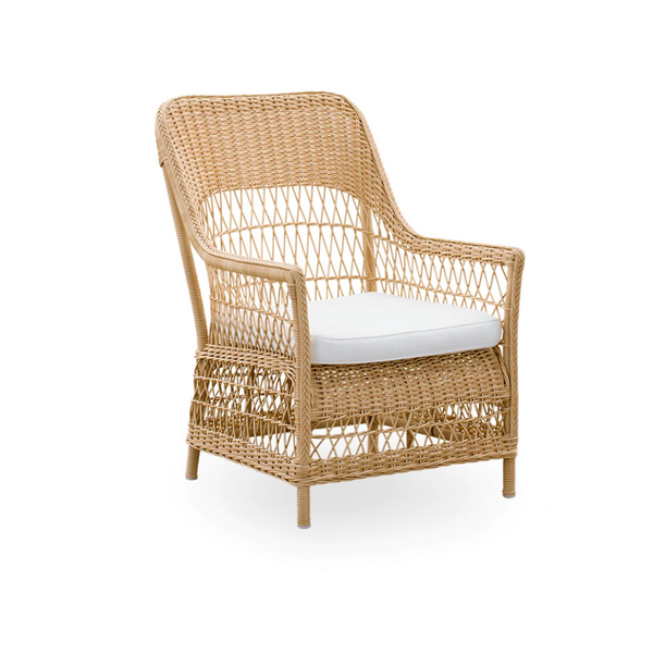 Natural rattan chair with light beige cushion, featuring a woven pattern and neutral tones for a stylish, relaxed look.