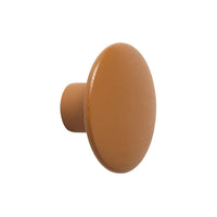 Brown round knob with a smooth matte finish, perfect for modern furniture accents.