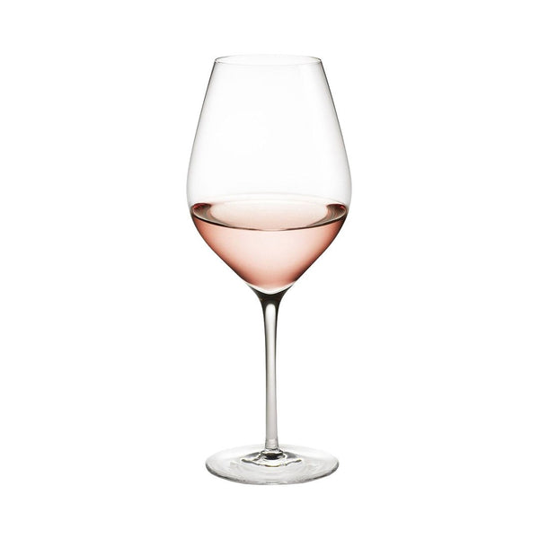 Elegant wine glass filled with light pink rosé, featuring a clear glass design for enhanced presentation.