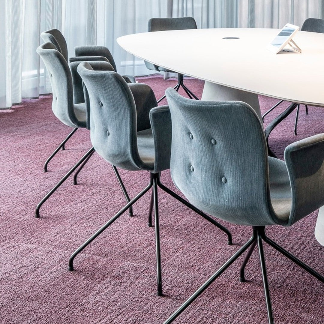 Gray upholstered chairs on a rich burgundy carpet in a modern conference setting. Elegant and stylish design.