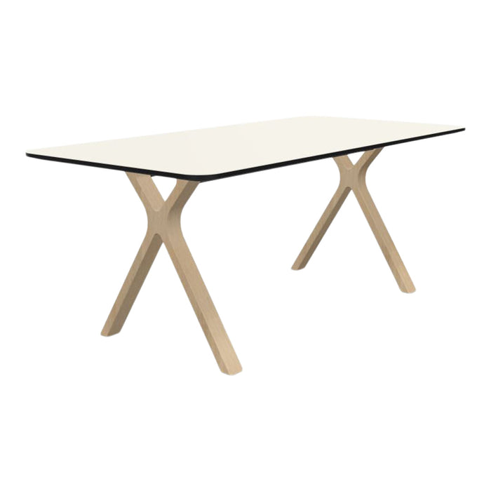 Modern white tabletop with black edge, supported by light wood cross legs. Minimalist design for contemporary spaces.