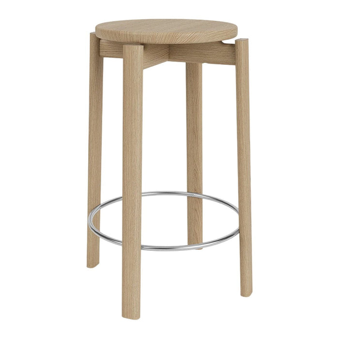 Natural wood stool with a light oak finish and a sleek chrome footrest. Minimalistic design and smooth surfaces.