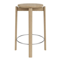 Natural wood bar stool with a light oak finish and minimalist design featuring a simple circular seat and metal footrest.
