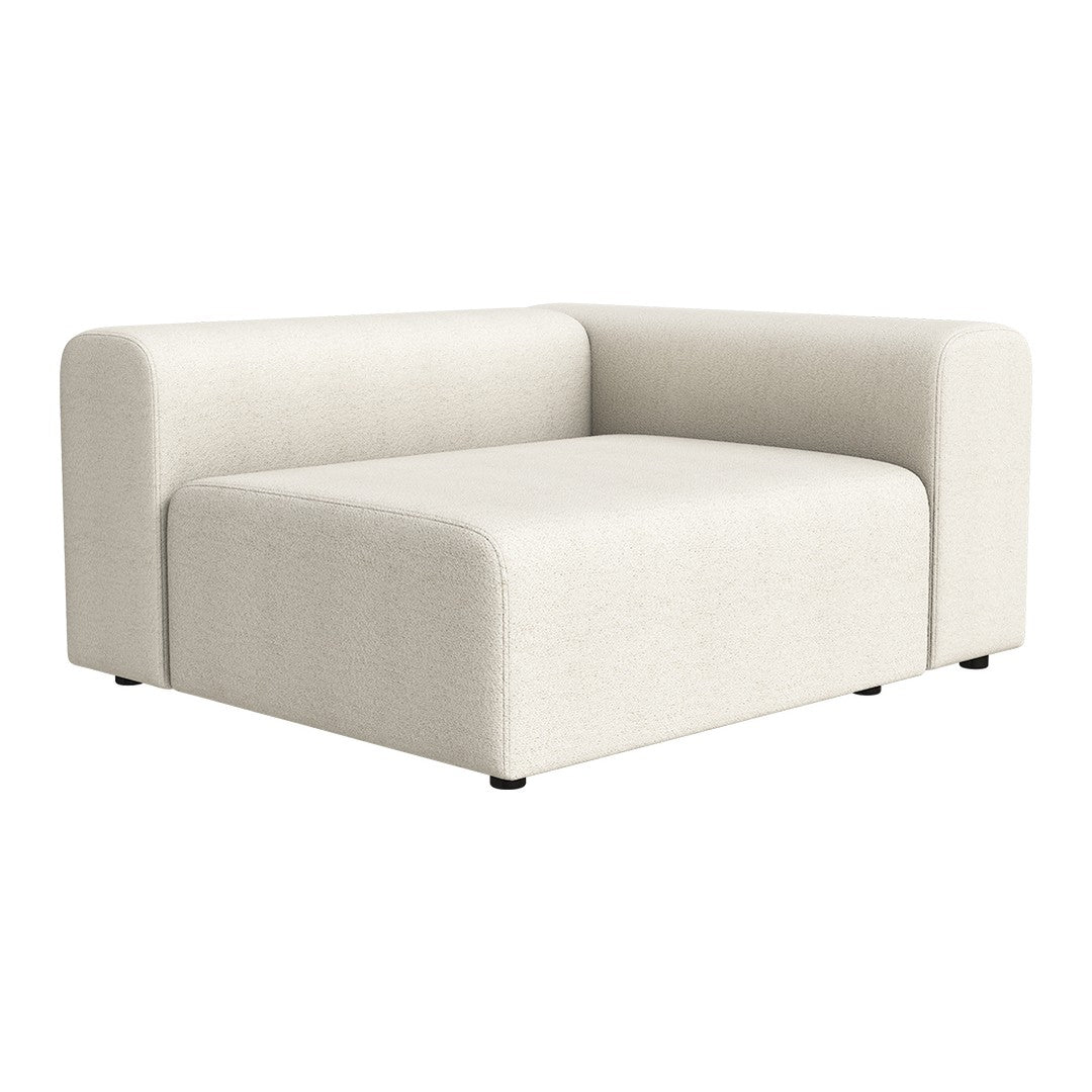Beige upholstered corner sofa with a minimalist design and soft, textured fabric.