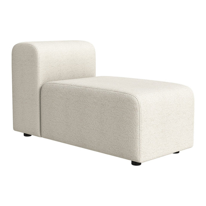 "Soft cream-white chaise lounge with a smooth fabric texture and modern minimalist design."