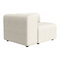 White fabric sectional sofa with a smooth texture and minimalist design, featuring rounded edges and clean lines.