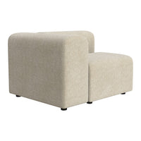Beige modular sofa with soft texture and subtle pattern, featuring rounded edges and black legs for contrast.