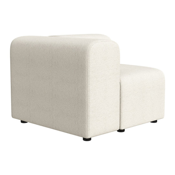 Cream-colored modular sofa with a smooth, textured fabric finish and rounded edges, perfect for modern decor.