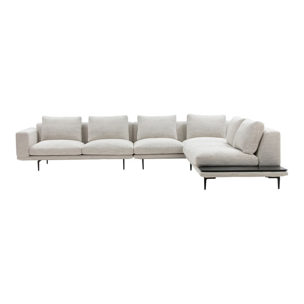 Light beige sectional sofa with a simple, modern design and plush cushions, featuring a sleek black base.
