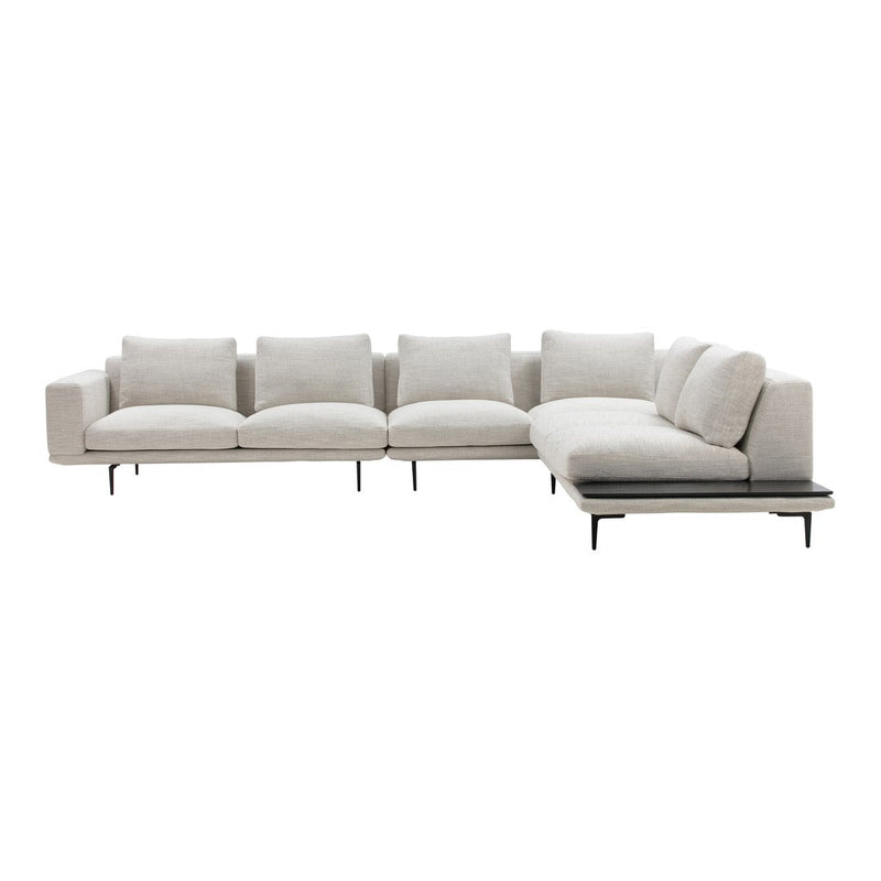 Light beige sectional sofa with a simple, modern design and plush cushions, featuring a sleek black base.