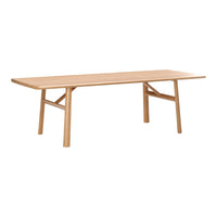Natural wood dining table with a light oak finish and simple, modern design featuring clean lines and no patterns.