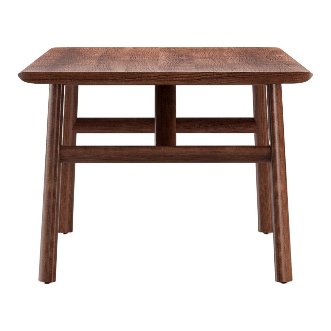 Wooden dining table in rich brown finish with a smooth surface and clean, modern lines. Perfect for any dining space.