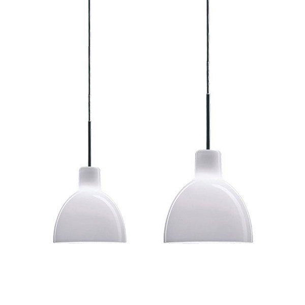 White pendant lamps with a sleek, modern design and smooth, glossy finishes hanging from black cables.