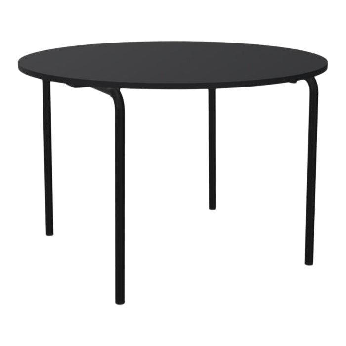 Round black table with a minimalist design and smooth surface, featuring sturdy black metal legs.