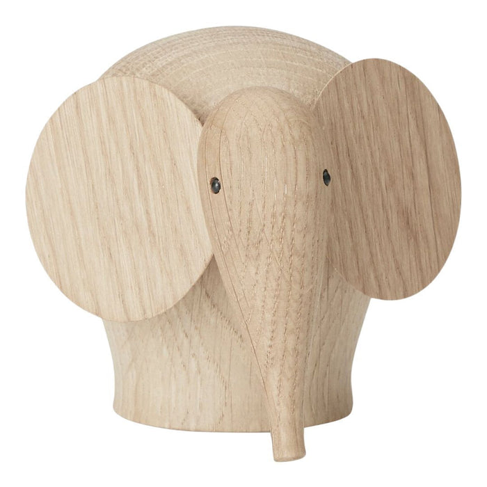 Natural wood elephant figurine in light beige tones with smooth, minimalist design and rounded features.