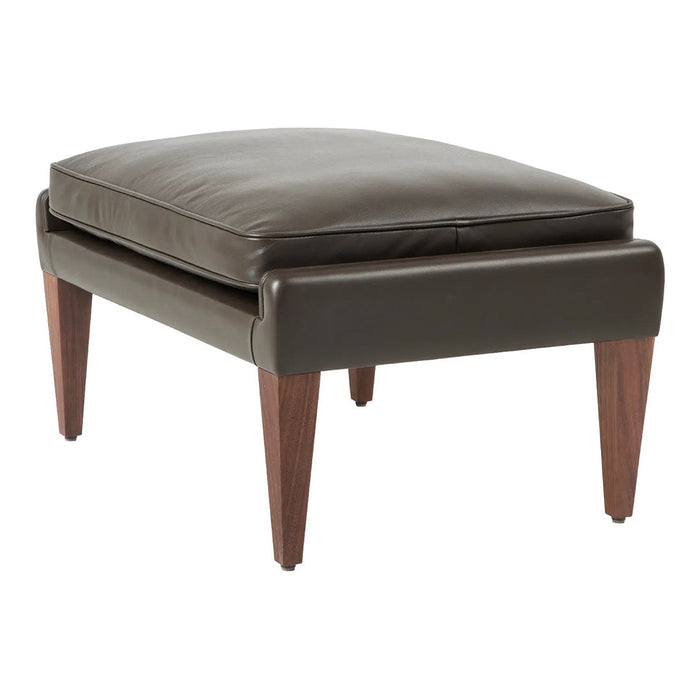 Brown leather ottoman with a smooth, modern design and tapered wooden legs, perfect for contemporary decor.