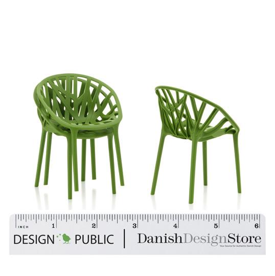 Green rattan-style chairs with a woven pattern, ideal for modern outdoor decor.